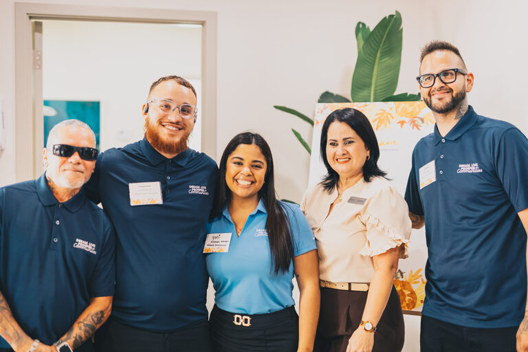Members of an on-site team at a community grand opening
